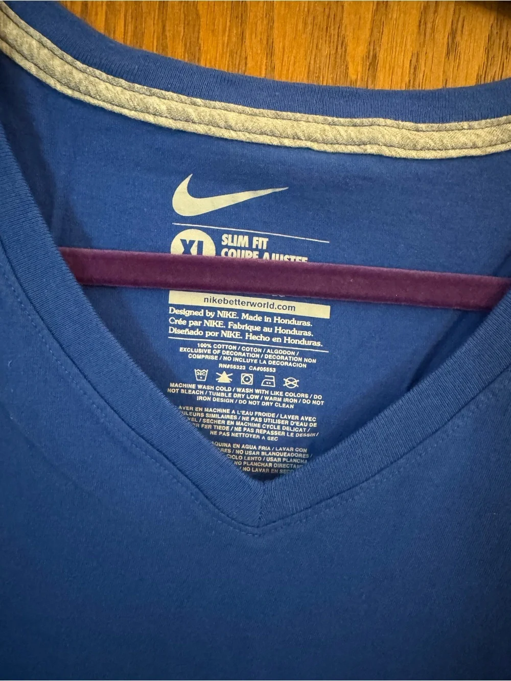 Nike Women's Royal Blue V-Neck Tee with White Patterned Swoosh